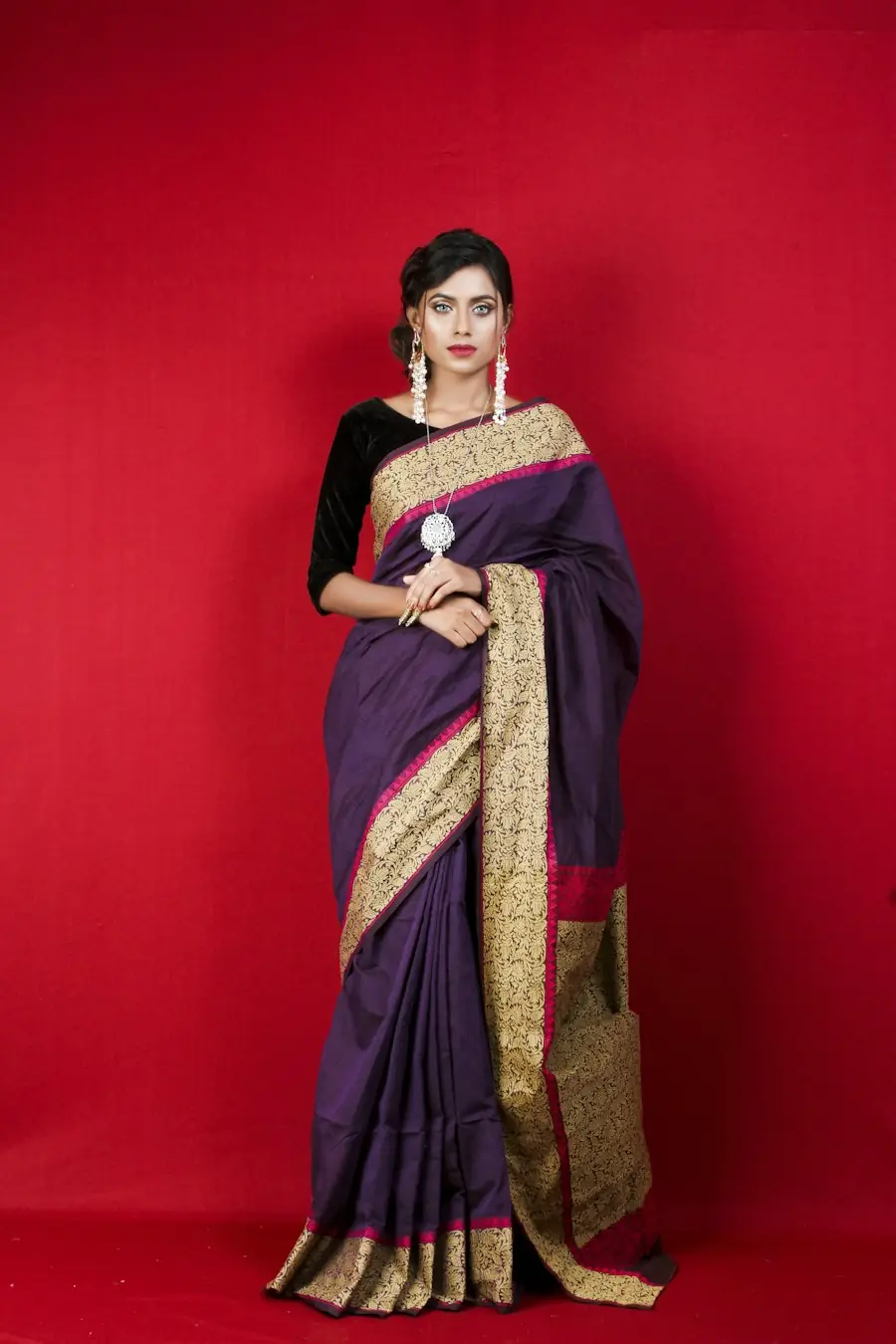 Woman in a purple silk saree
