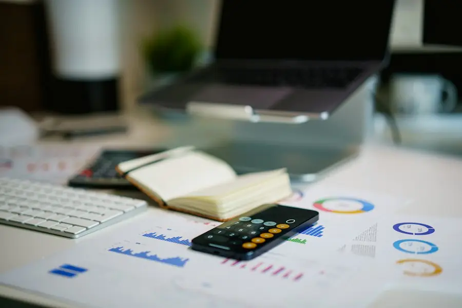 Desk with financial charts and a calculator