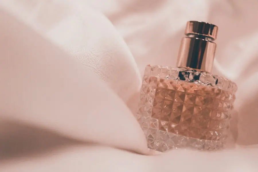 Glass perfume bottle on soft fabric
