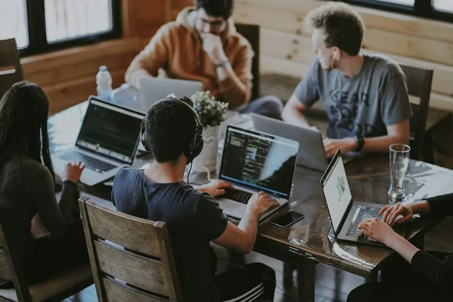 Startup team working on laptops